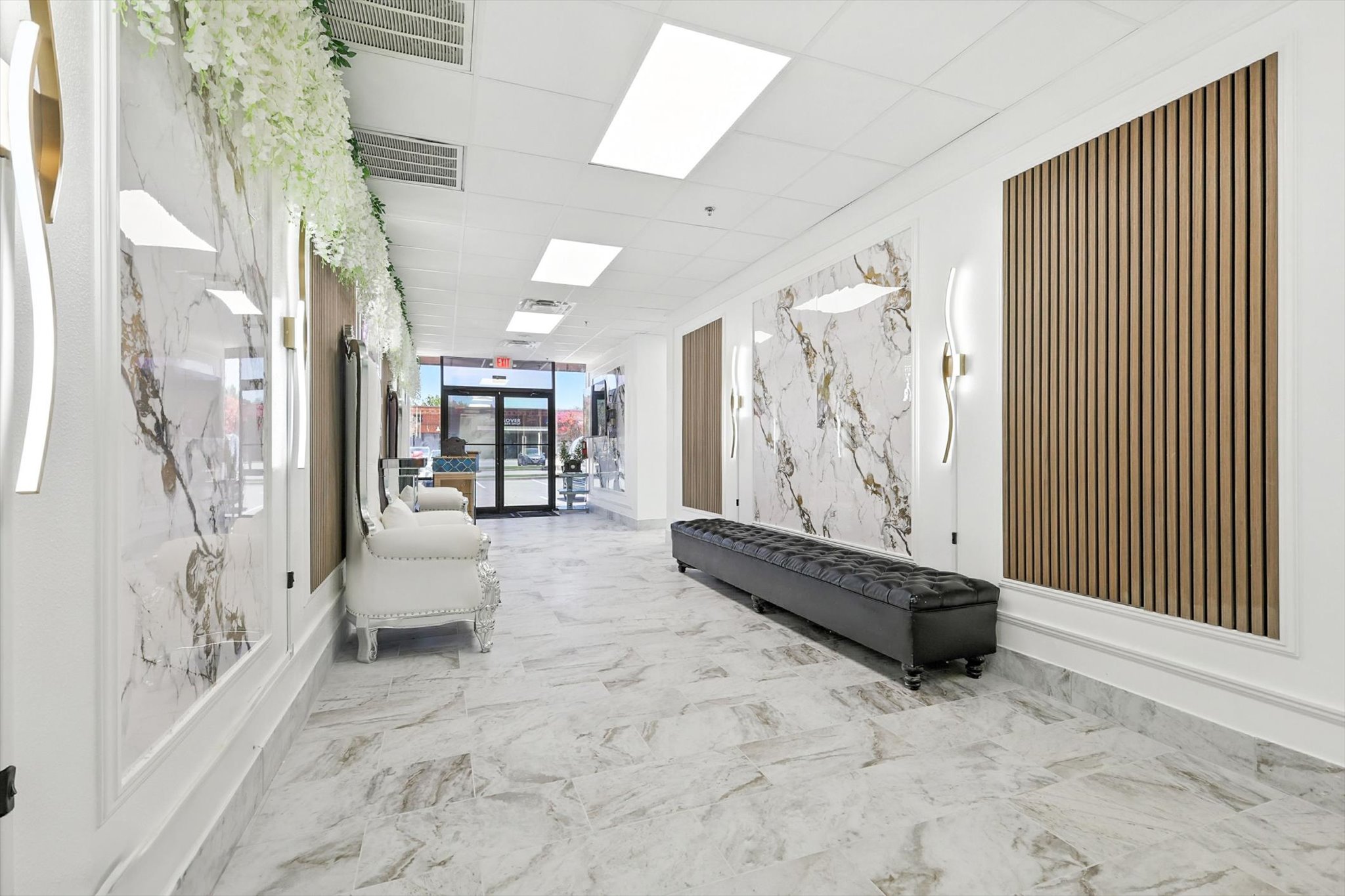 Reception and lounge at Paradise Suites & Salon in Allen, TX